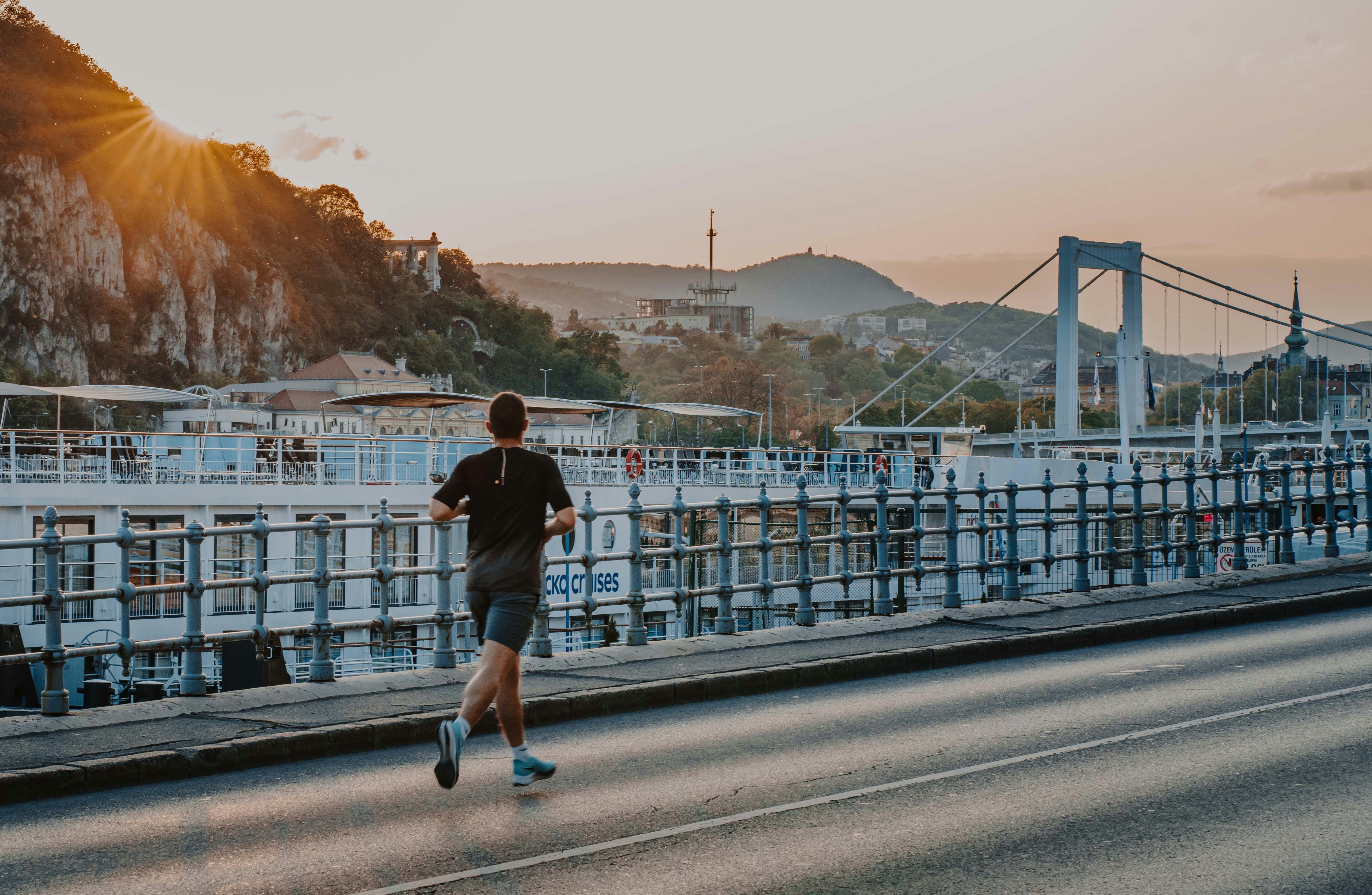 How to Stay Consistent With Fitness When You Travel Often – a man running on a road