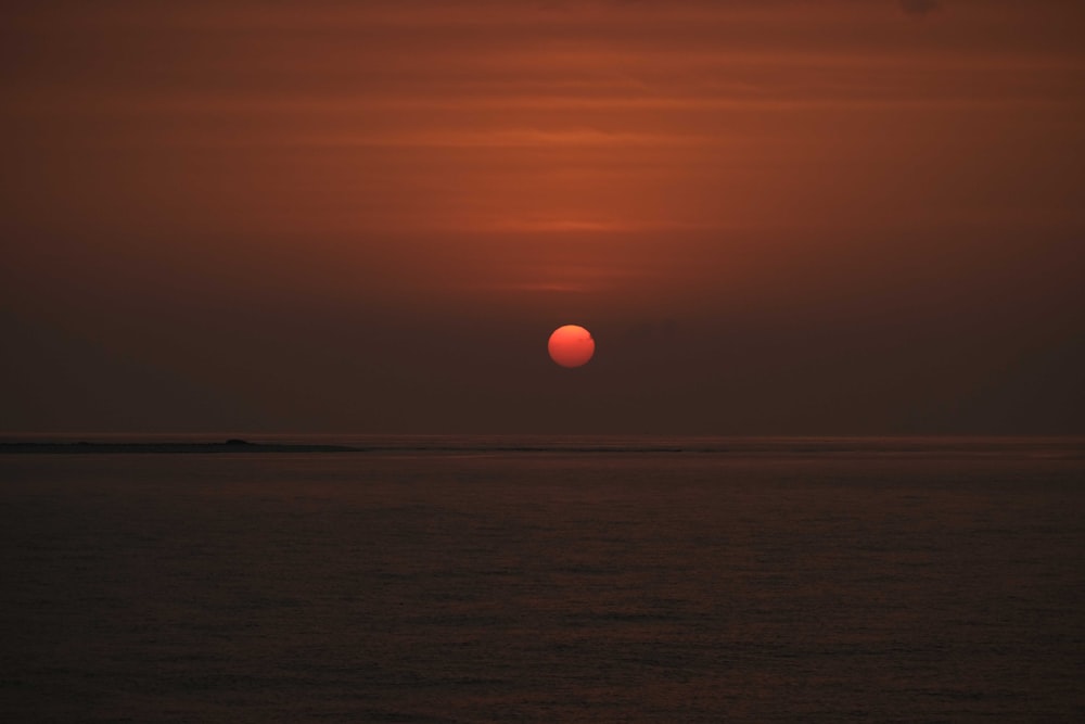 a sunset over a body of water