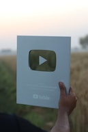 a hand holding a card