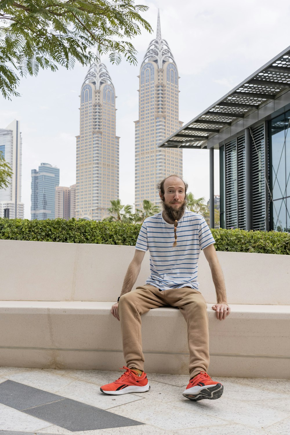 a man sitting on a ledge