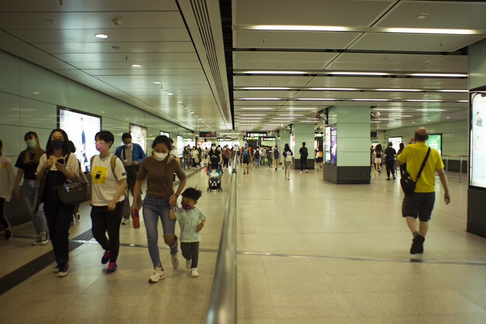 a group of people walking in a large room