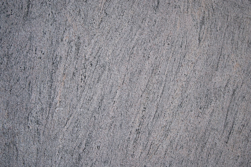 a grey surface with cracks