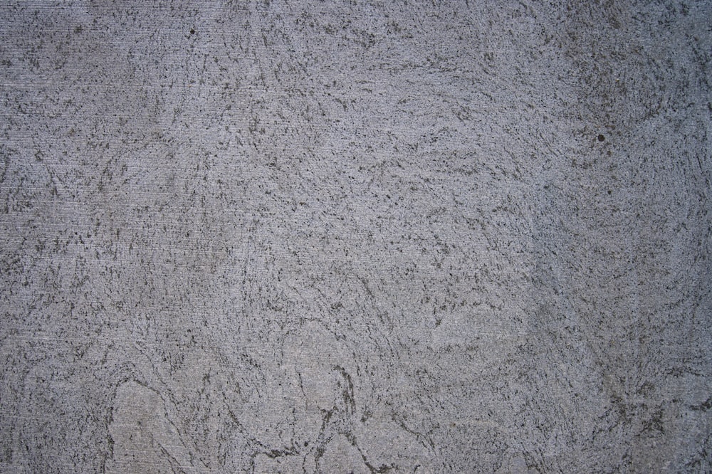 a grey surface with cracks