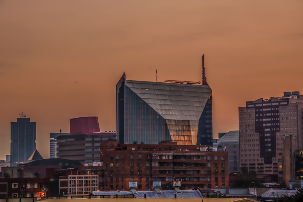 a city skyline with a large building