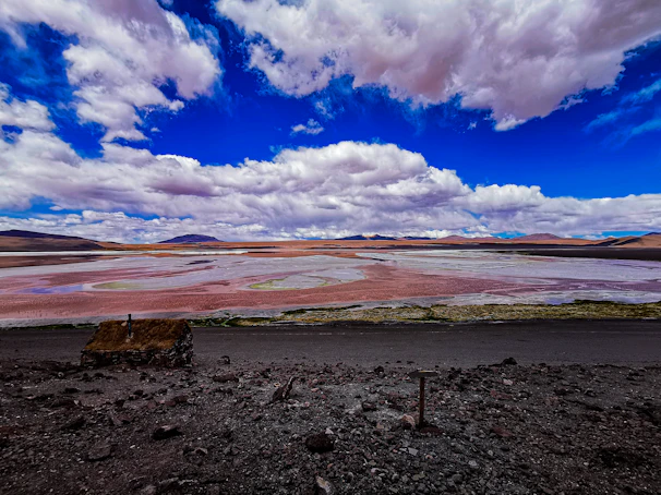 Panoramic landscape showing the vast mineral-rich regions of West Africa under a dramatic sky.