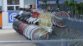 a group of bicycles parked on a sidewalk
