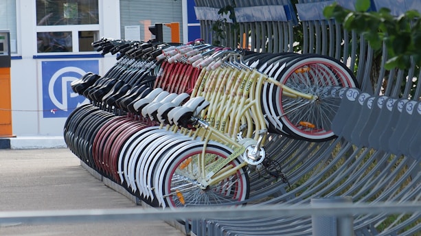 a group of bicycles parked on a sidewalk