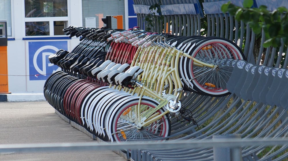 a group of bicycles parked on a sidewalk