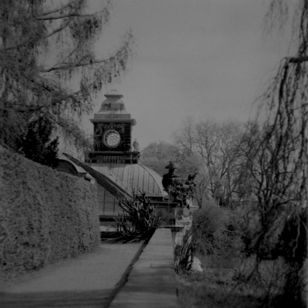 a clock tower on a bridge