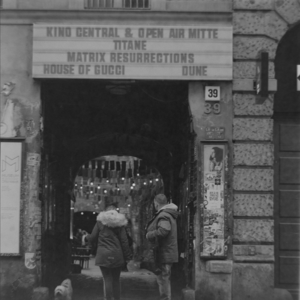 people walking through a building