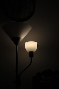 a lamp with a clock on the wall