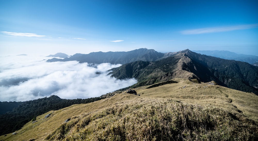 a landscape with hills and clouds