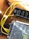 A close-up of various electrical components including cable lugs and earthing rods on a workbench.