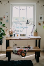 a living room filled with furniture and a large window