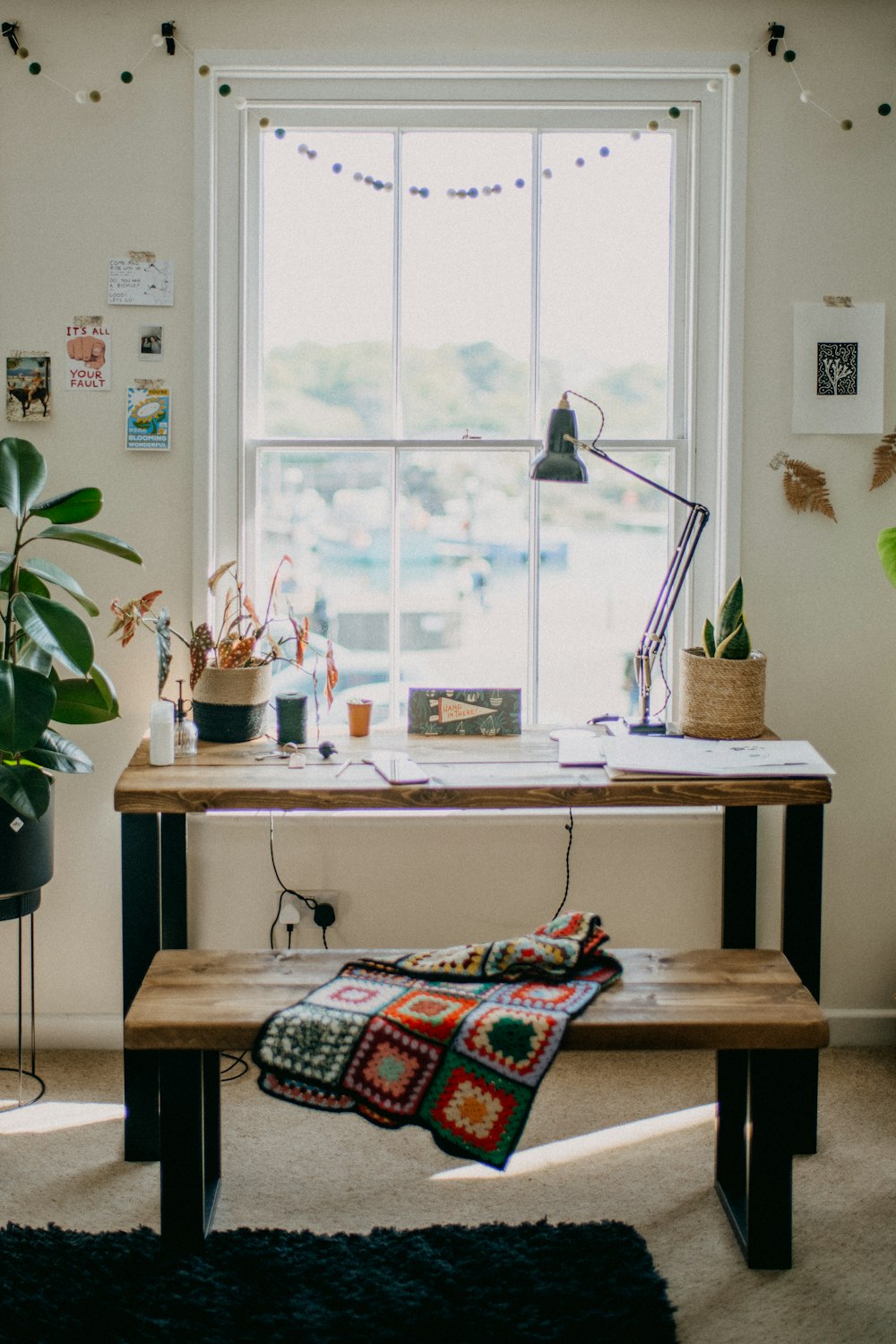 a living room filled with furniture and a large window