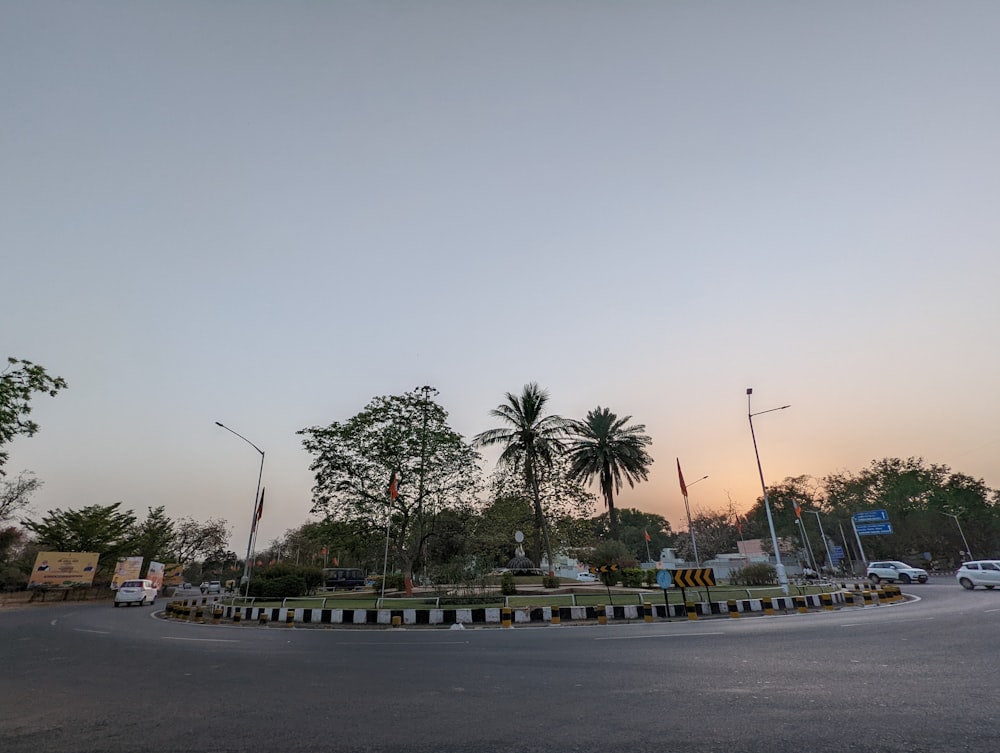 a street with cars and trees