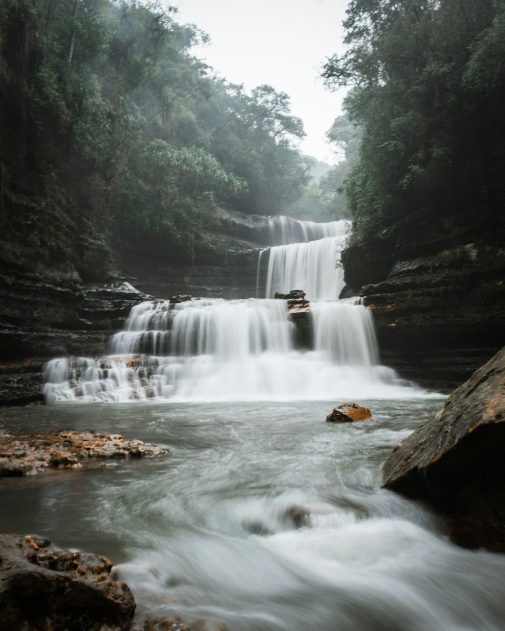 a waterfall in a forest