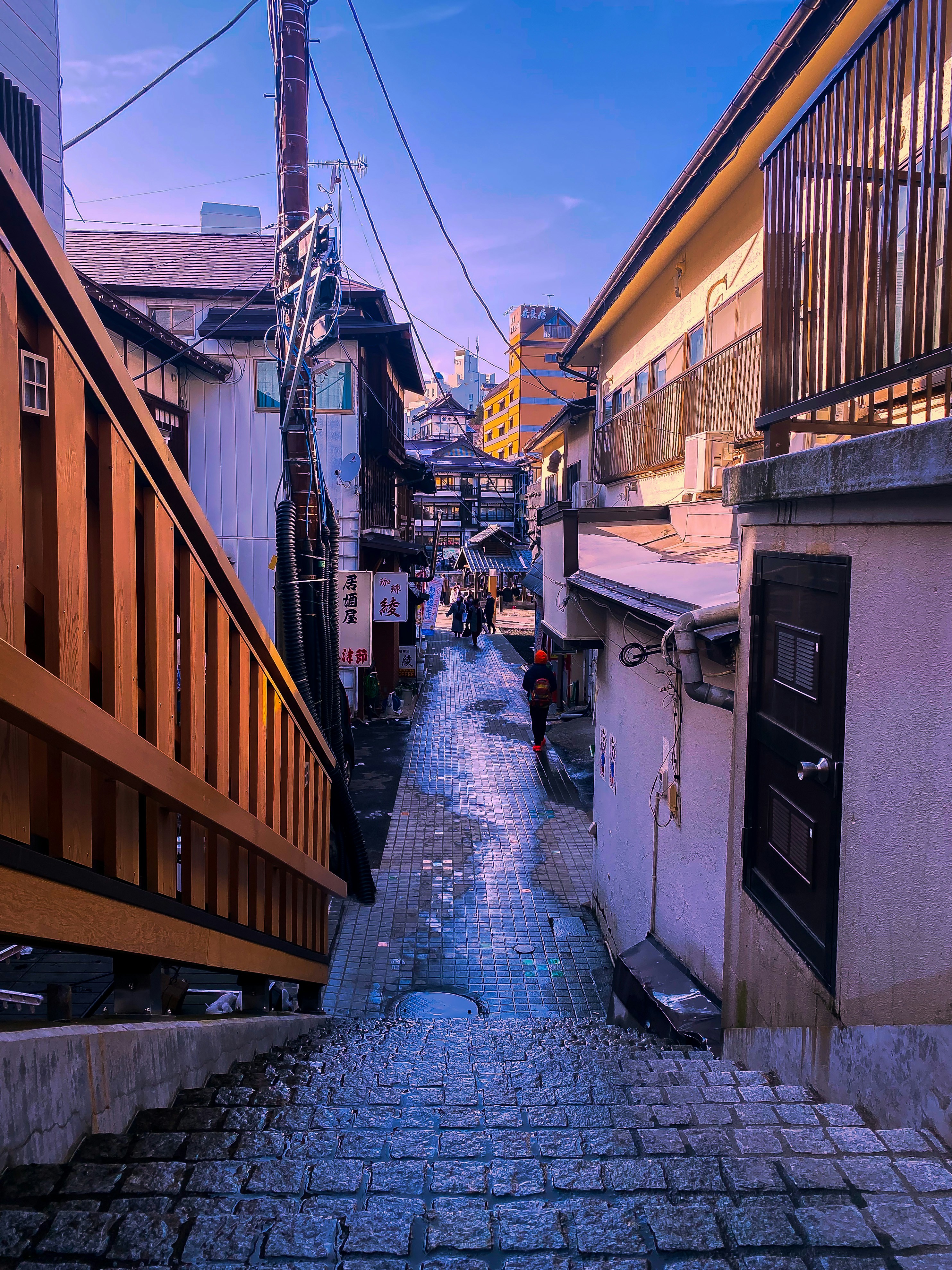 a cobblestone street with buildings on either side of it