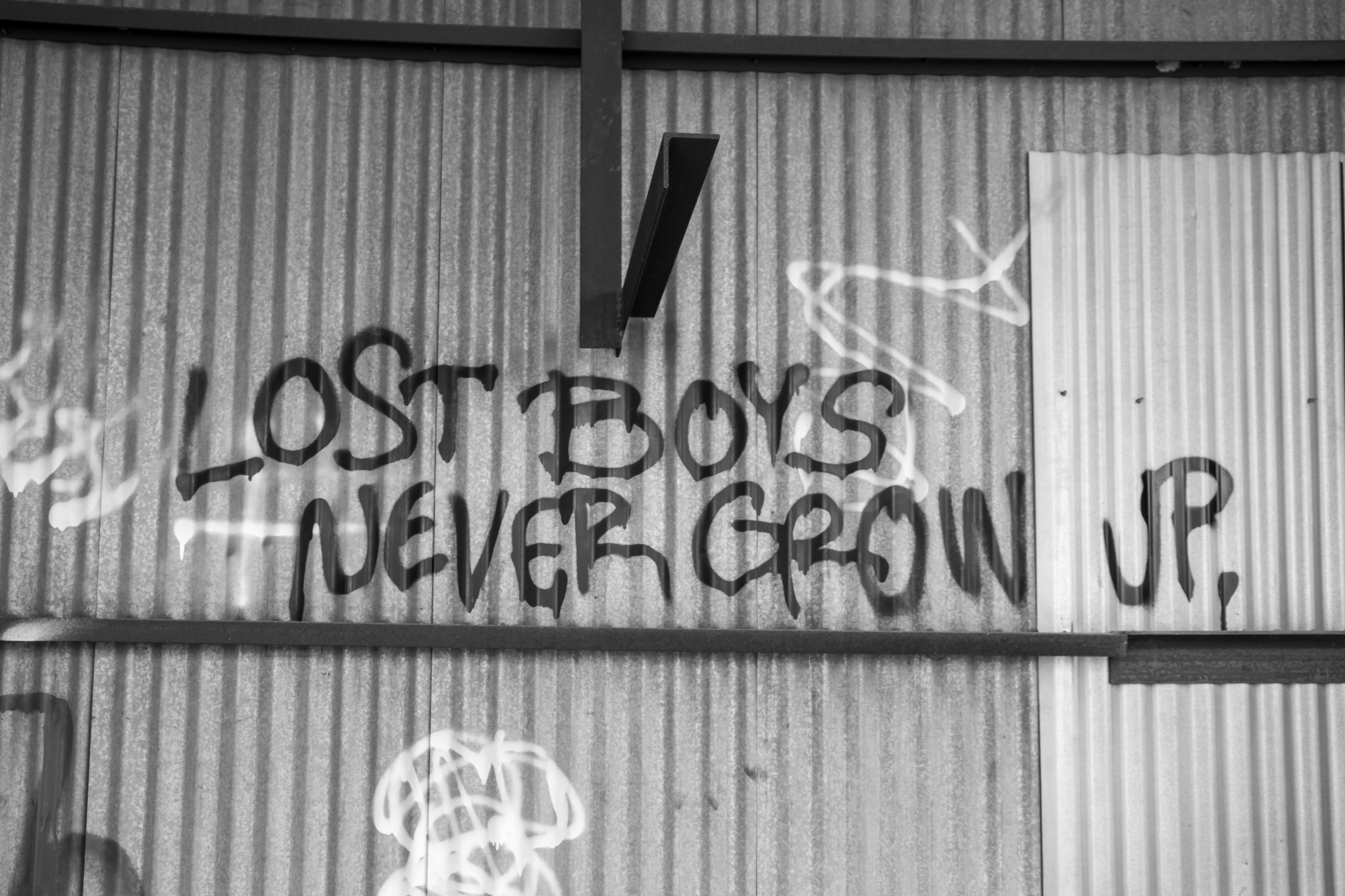 A sign on a wall photo – Free Grey Image on Unsplash