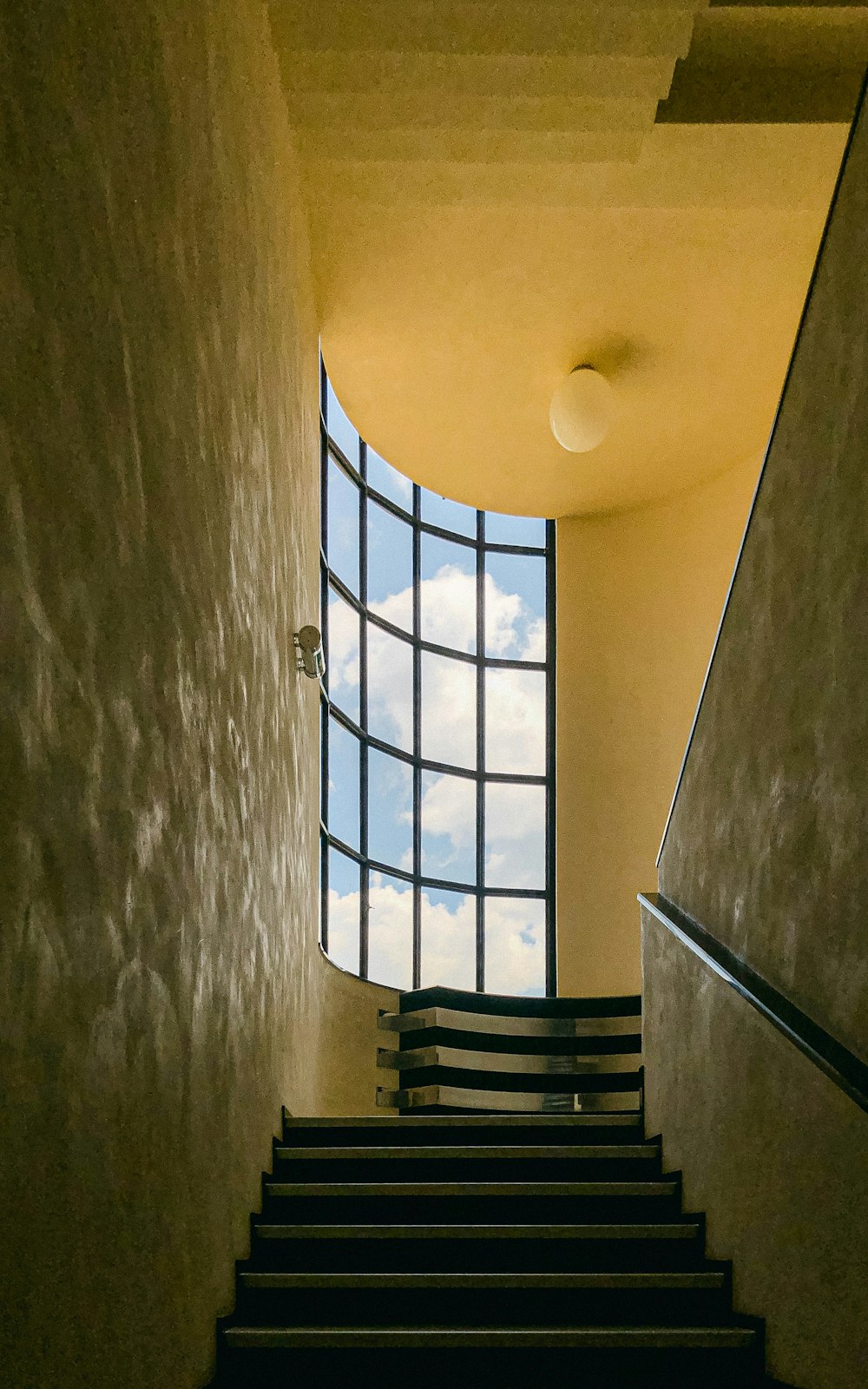 a staircase leading up to a window