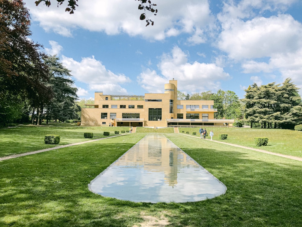 a large building with a fountain in front of it