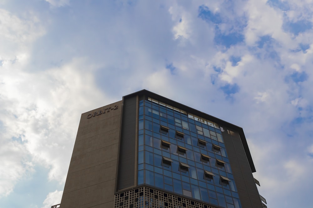 a tall building with a blue sky