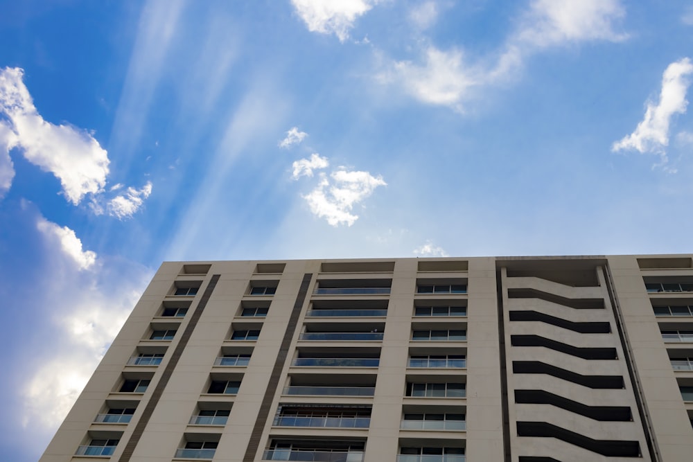 a tall building with a blue sky