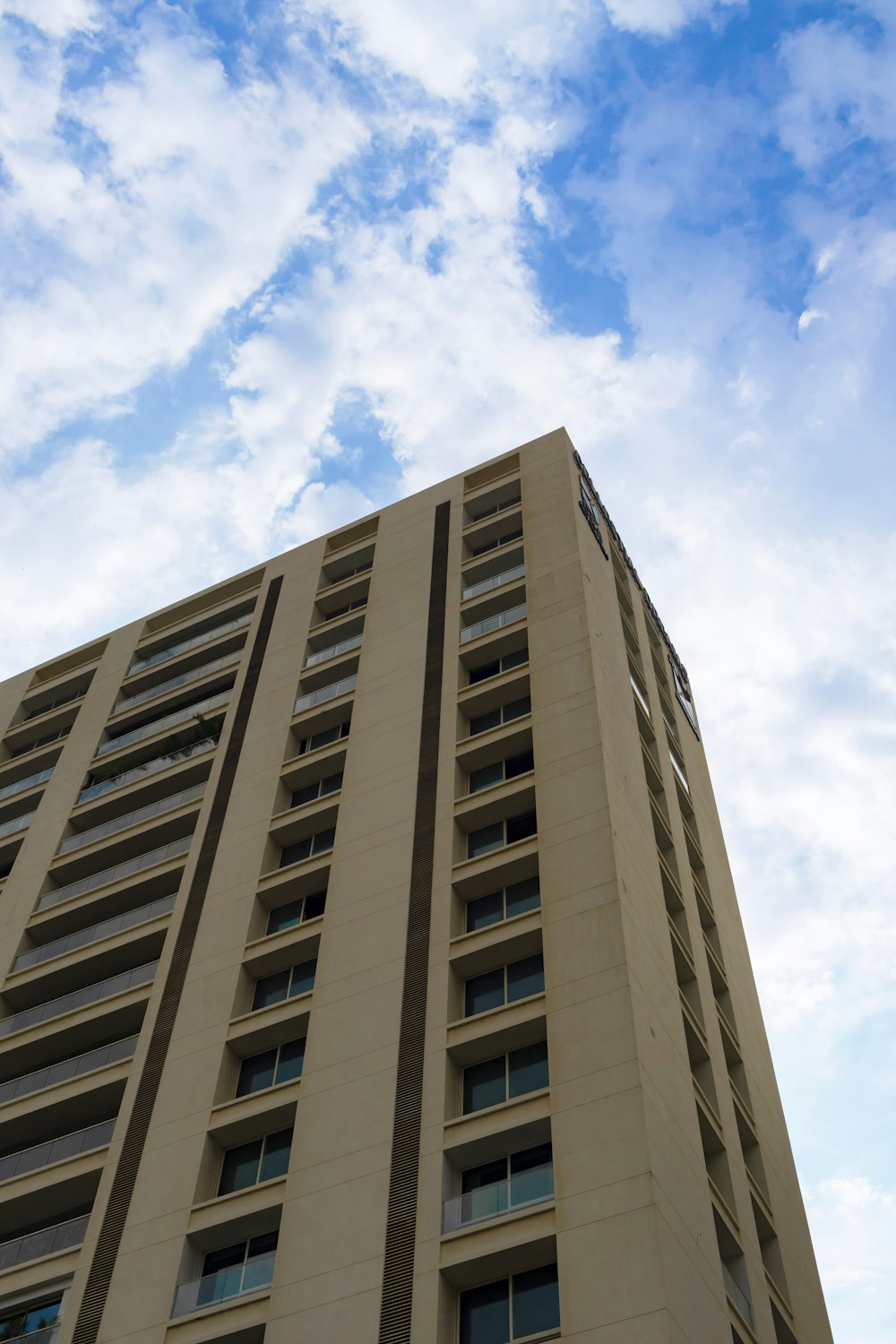 a tall building with a blue sky