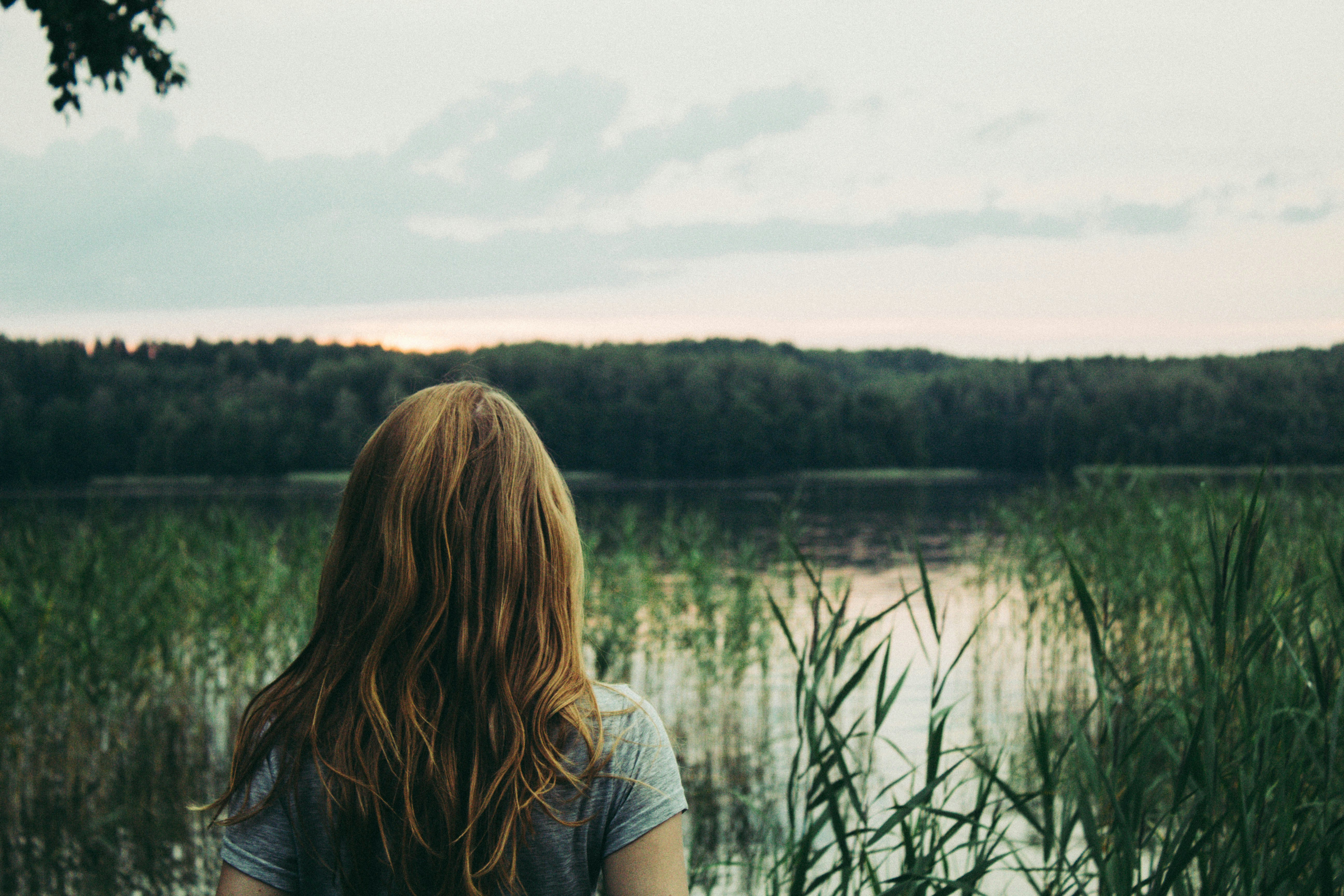 a person looking at a lake