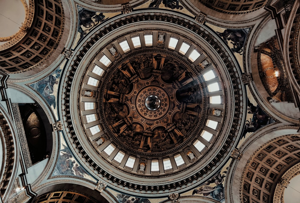 a large domed ceiling with many intricate designs