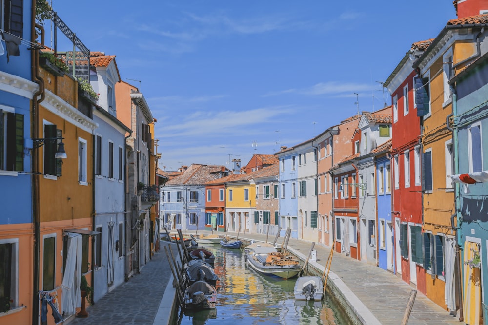 a canal with colorful buildings