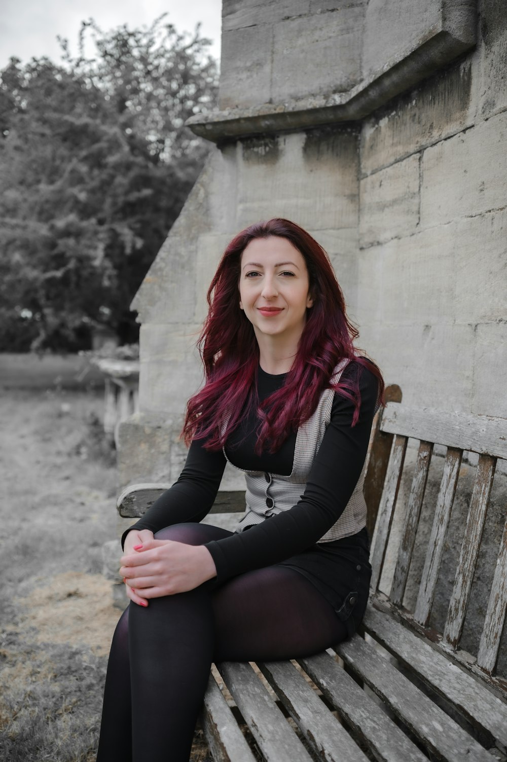 a woman sitting on a bench