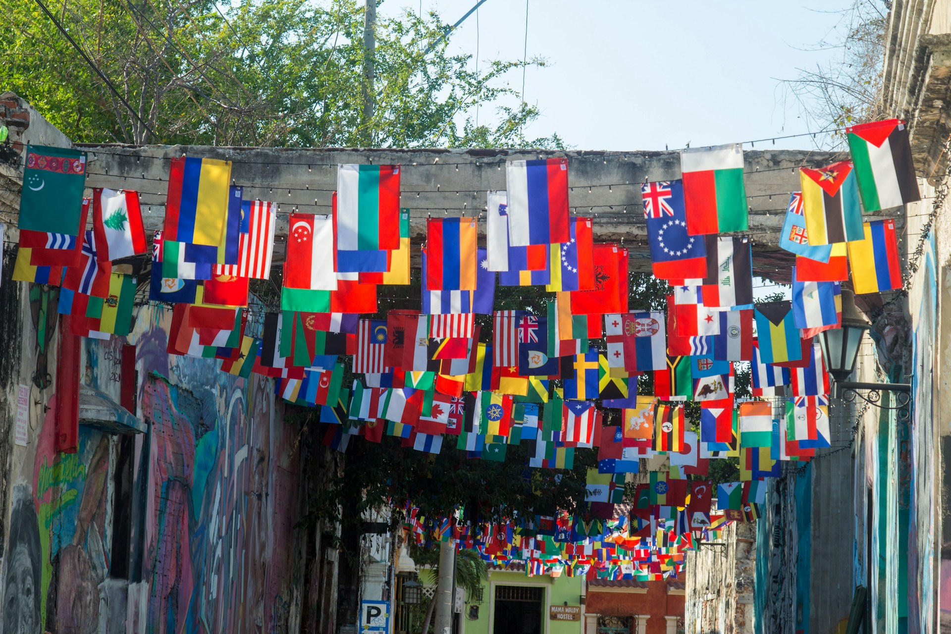 a wall with a bunch of flags