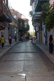 A lively street scene in the Gothic Quarter with narrow alleys and historic buildings.
