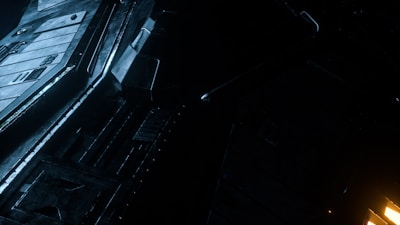 Technical blueprint with golden metallic lines highlighting structural details.