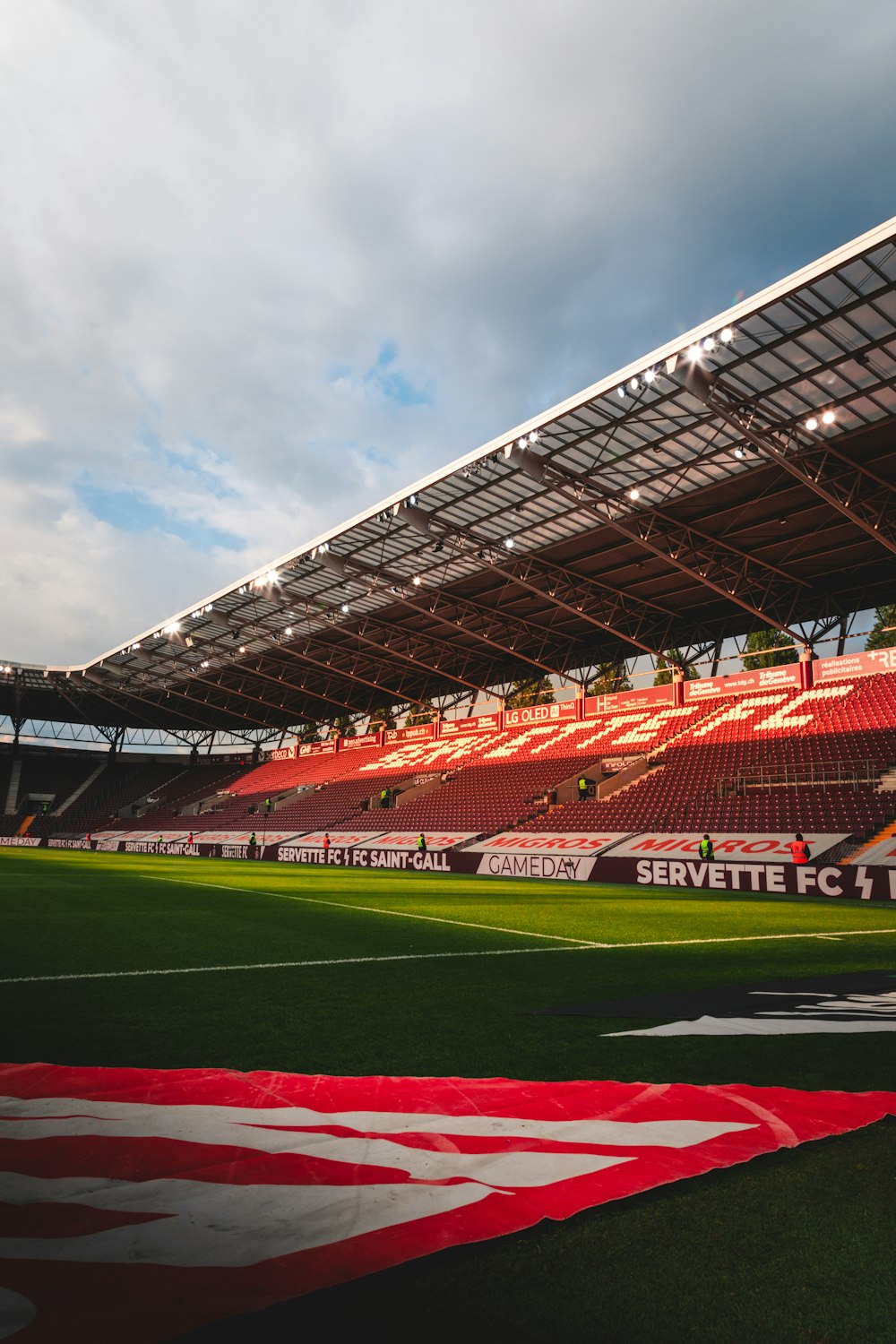 a large stadium with a field and a field with a large crowd