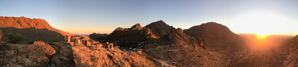 a rocky landscape with a sunset