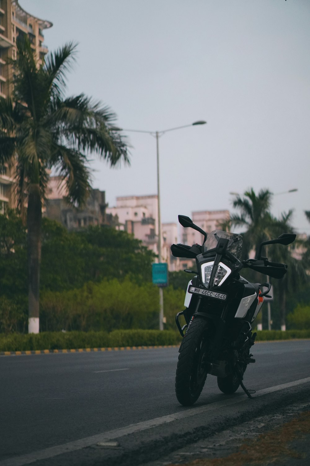 a motorcycle parked on the side of a road