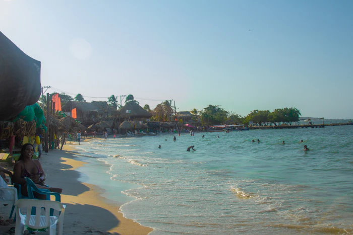 People swimming in clear Caribbean water near Cartagena