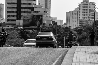 A vibrant cityscape of Brazil showcasing cars and motorcycles.
