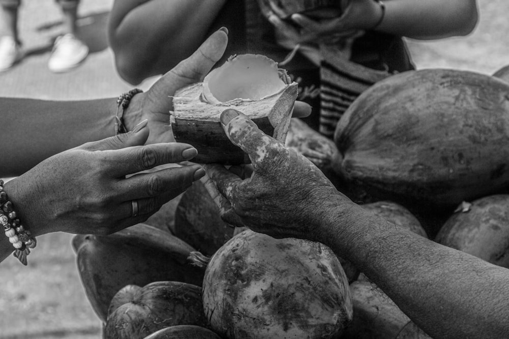 a person holding a bunch of mushrooms