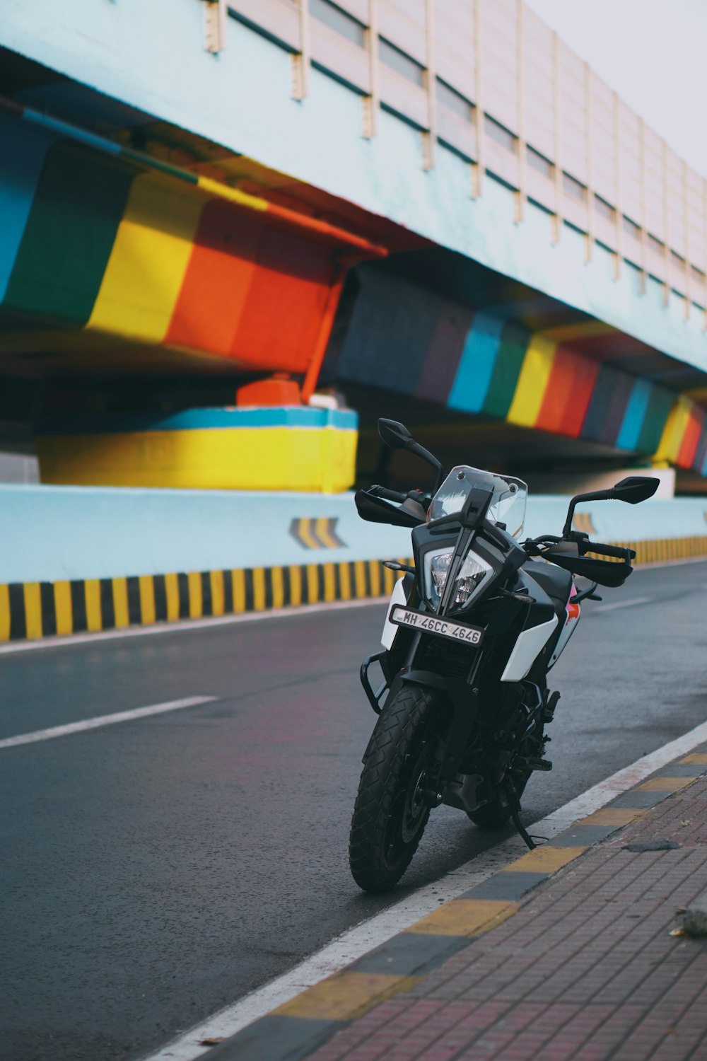 a motorcycle parked on the side of a road