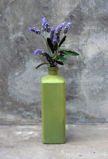 a vase with purple flowers