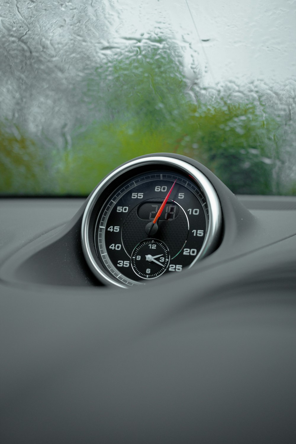 a car dashboard with a speedometer