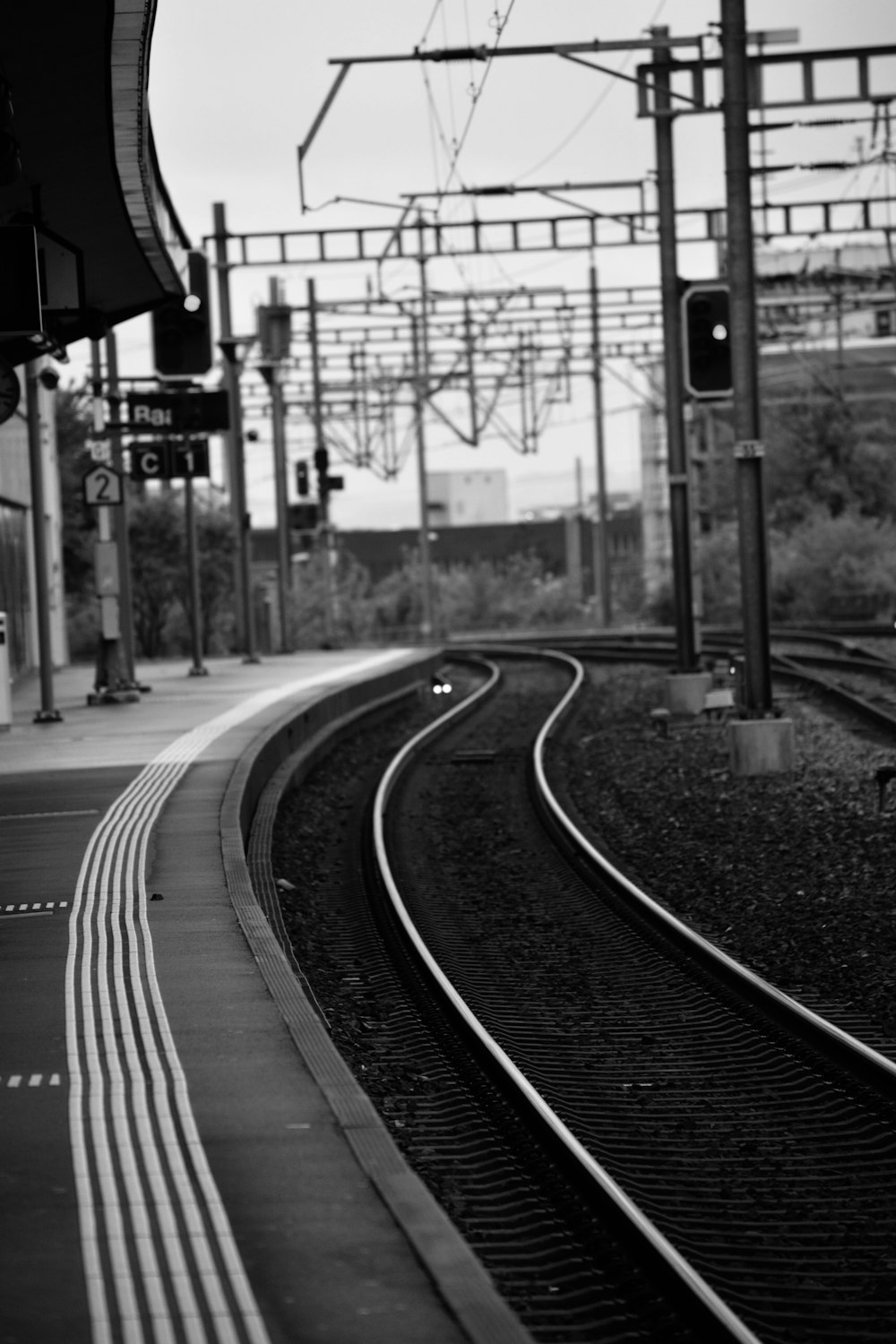 train tracks next to a platform