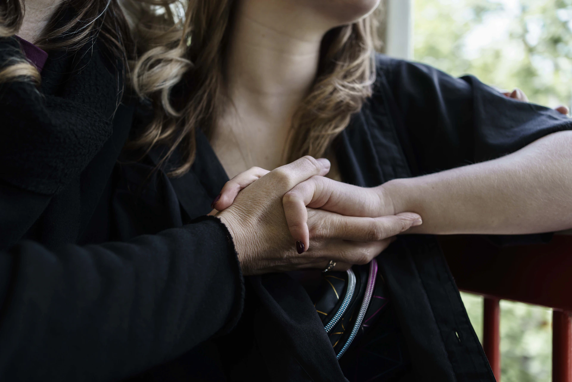 a woman holding her hand over her chest
