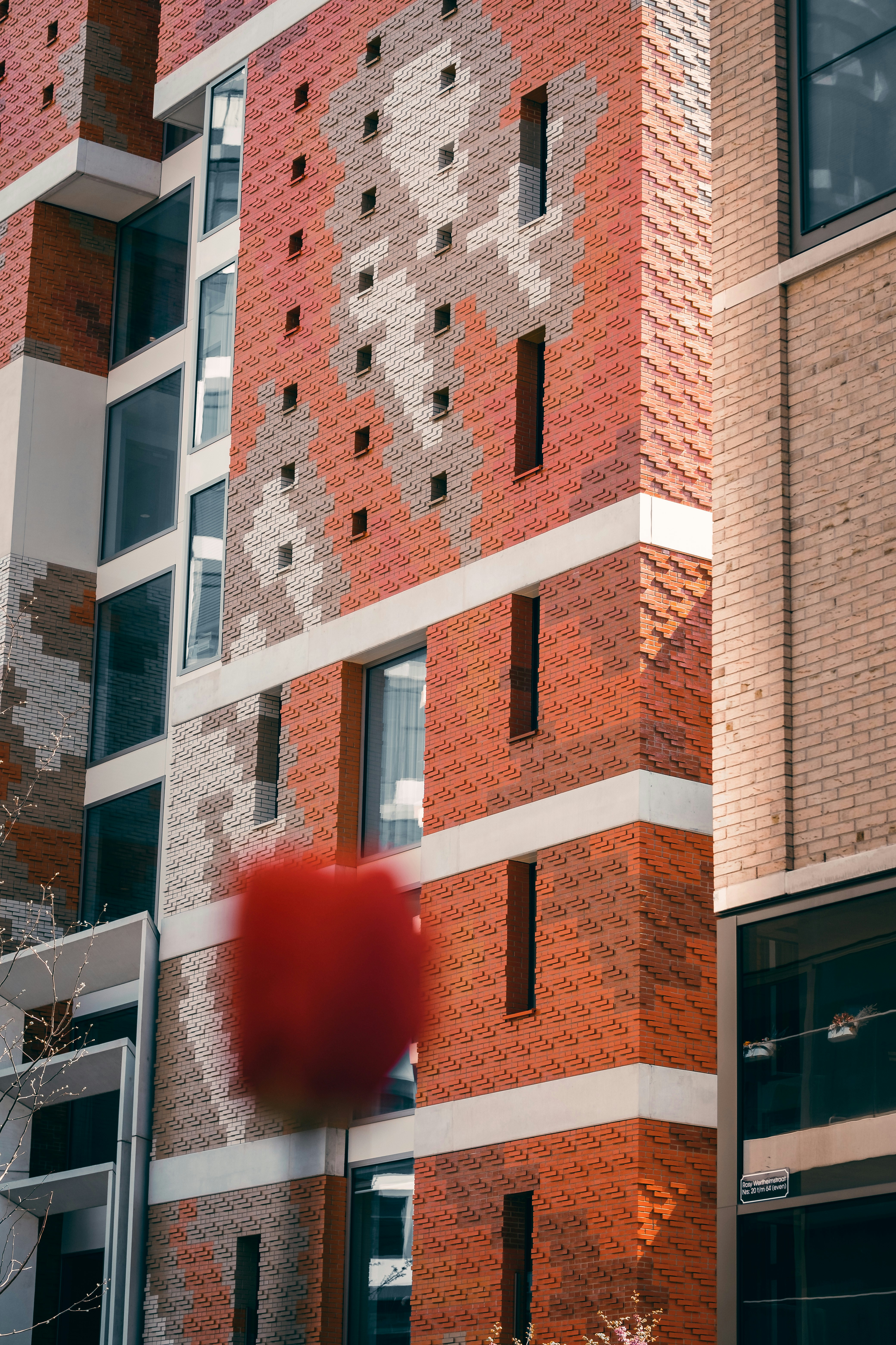 a building with a red ball in front of it