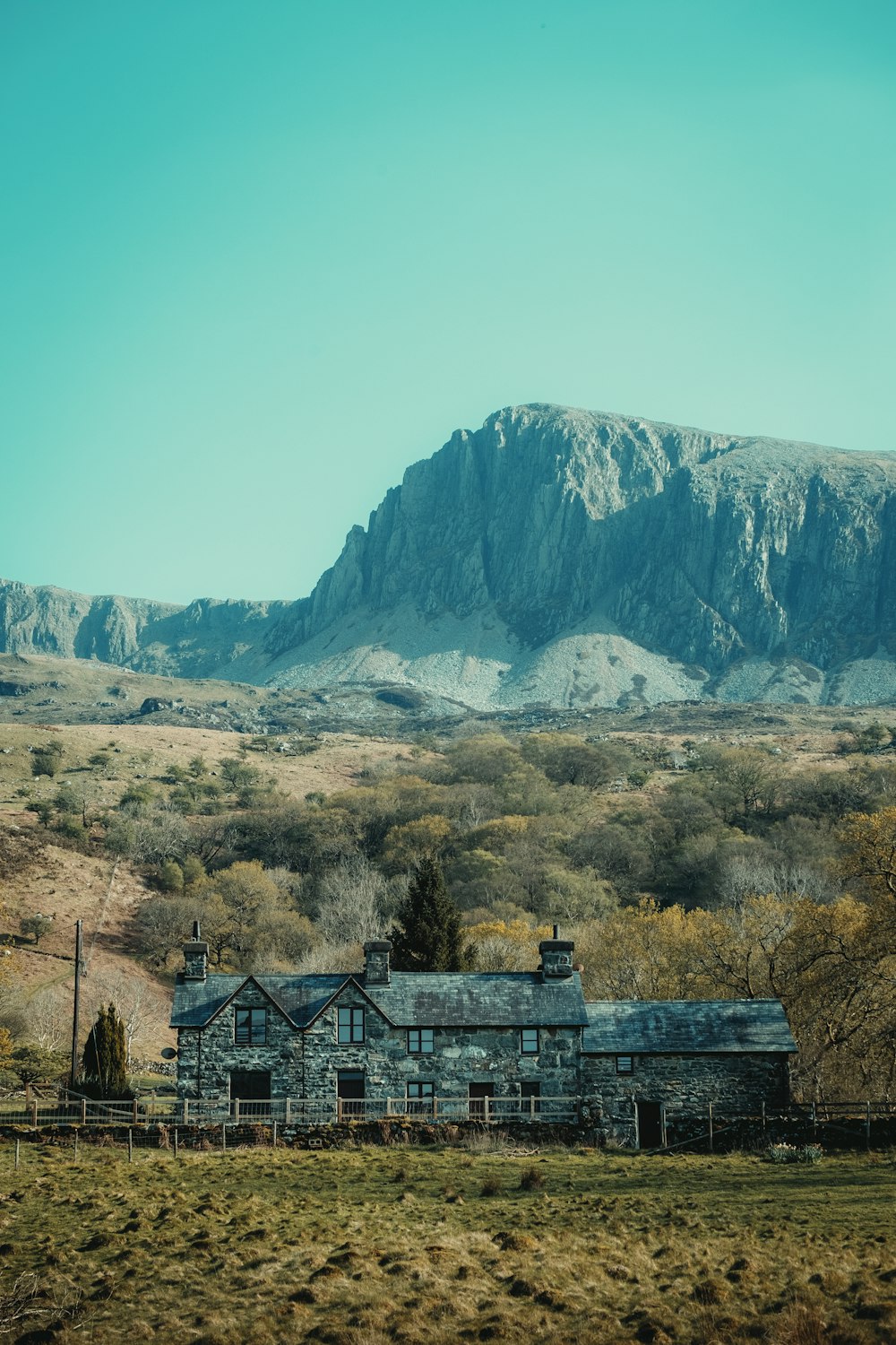 a house in front of a mountain