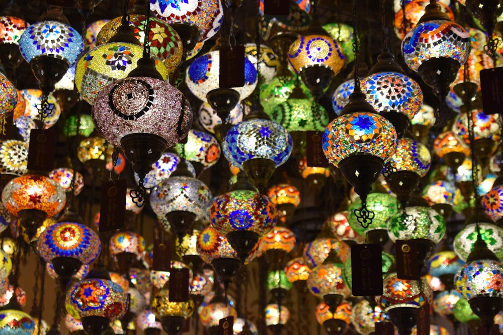 a wall of colorful lamps