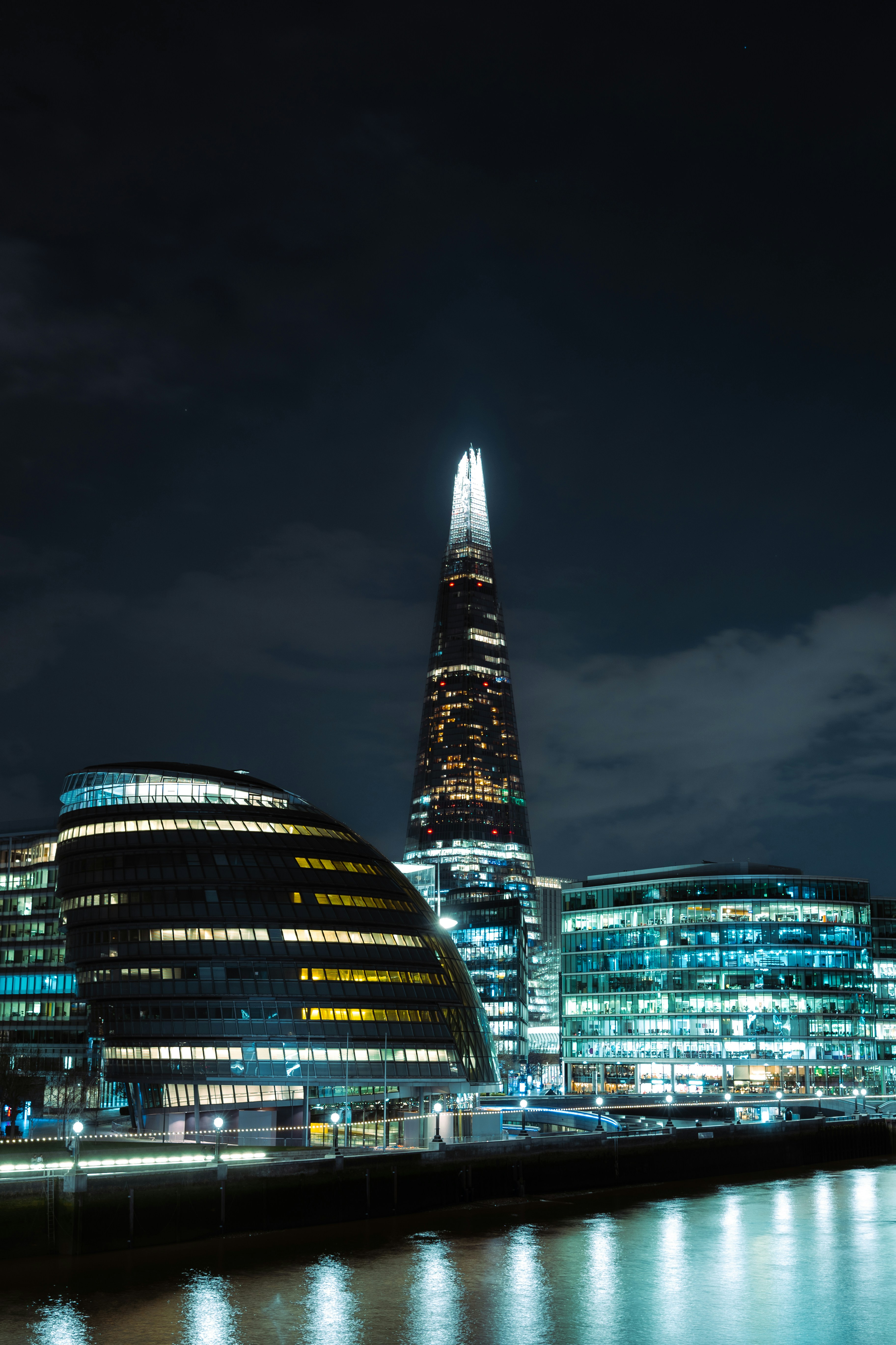 a tall building with lights at night